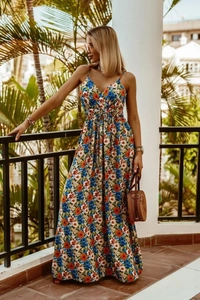 Detailed view of women's V-neck floral maxi dress in vibrant orange and blue print