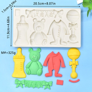 Macro detail of baby themed silicone mold with bottle, teddy bear, and letter shapes