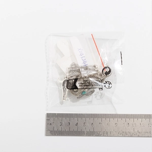 Detailed size measurement of turquoise bull skull pendant necklace in packaging
