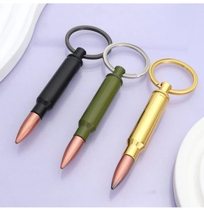 Detailed bullet-shaped metal bottle opener keychains in black, green, and gold colors