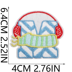 Close-up of letter M embroidery patch with headphones and scarf detailing, 6.4cm height