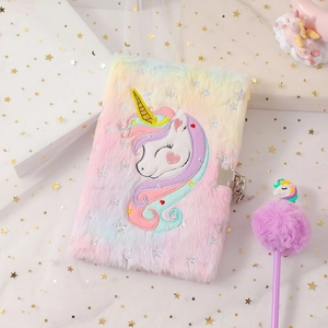Rainbow plush unicorn diary with lock and ballpoint pen on white starry mesh fabric