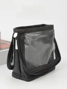 Close-up of portable makeup brush bag with dual metal zippers and transparent mesh PVC