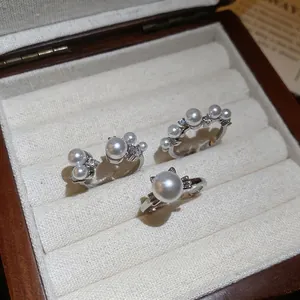 Three-piece silver pearl ring set with cat ear design and zircon stones for women