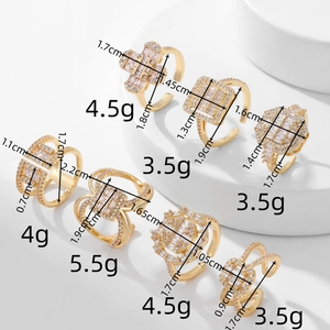 Detail view of gold rings with zircon stripes showing product size and weight metrics