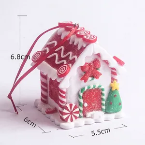 Detail of Christmas candy house ornament with red bow, frosted glitter and 6.8cm height