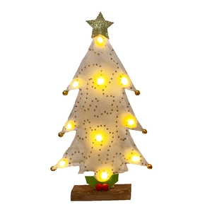 Detail of white felt mini Christmas tree with warm LED lights and a golden star topper