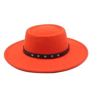 Close-up of red wool fedora with black leather band and silver star rivets details