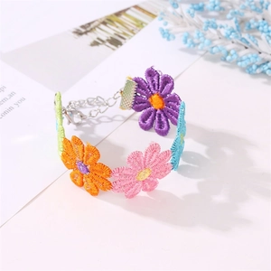 Close-up of colorful embroidered daisy necklace with adjustable lobster clasp and metal chain