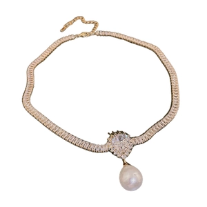 Gold plated pearl and zircon necklace featuring a crystal pendant on a white background