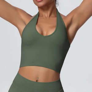 Macro detail of dark green ribbed knit fabric and halter V-neck stitch on sports crop top