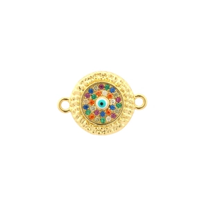 Detailed macro view of gold-plated evil eye charm with colorful zircon inlay and hammered texture