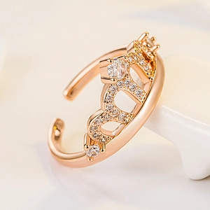 Rose gold crown ring with sparkling cubic zirconia stones and adjustable open band design