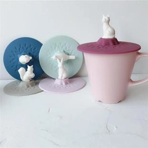 Detail view of colorful silicone cup lids with 3D animal handles like cats and rabbits