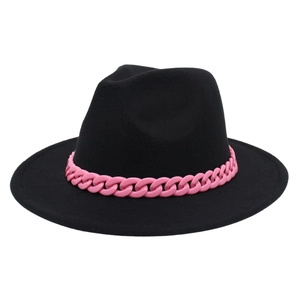 Detail of a black jazz fedora featuring a bold pink acrylic chunky chain accessory