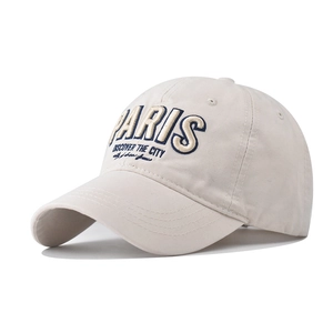 Close-up of high-quality PARIS 3D embroidery on beige washed cotton baseball cap