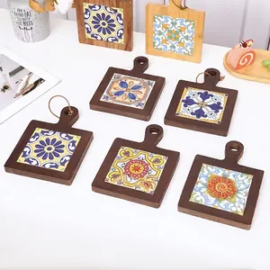 Retro wooden coaster set with colorful ceramic floral tiles and leather hanging loops