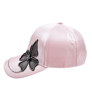 Pink satin baseball cap featuring black mesh butterfly wings and sparkling rhinestones