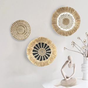 Detailed trio of bohemian woven straw wall hangings with fringe and geometric textures