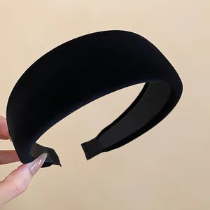 Thick black velvet headband for high cranial top effect with soft padded fabric texture