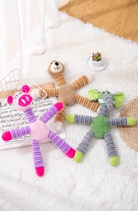 Close-up of textured corduroy plush pet toys in pig, bear, and elephant shapes