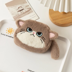 Close-up of fluffy plush cat coin purse with blue embroidered eyes and a soft tail