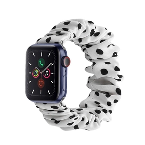 Detailed view of white black polka dot scrunchie band for Apple Watch in soft fabric