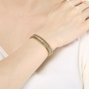 Close-up of 18K gold plated bracelet with colorful zircon stones worn on wrist