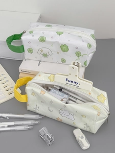 Detail of large capacity pencil pouches with cute cartoon dog and rabbit patterns