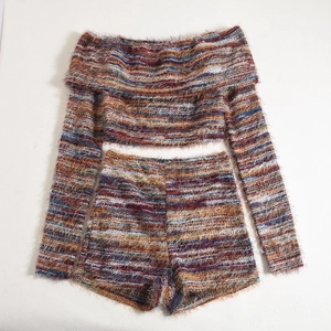 Detailed flat lay of striped knit two-piece set featuring off-shoulder top and shorts