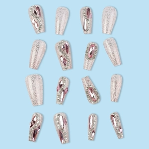 Sparkly pink and silver press-on nails set with rhinestones in long coffin shape