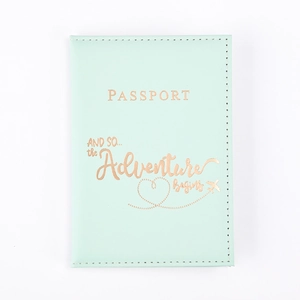 Detailed view of mint green PU leather passport cover with rose gold adventure text