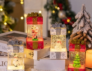 Luminous Christmas gift box lanterns with Santa and Snowman inside swirling glitter