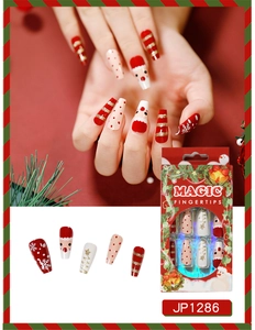 Macro detail of Christmas press on nails with Santa and snowflake patterns in a 24pc set