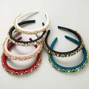 Flat lay of luxury padded headbands with crystals and colorful rhinestones