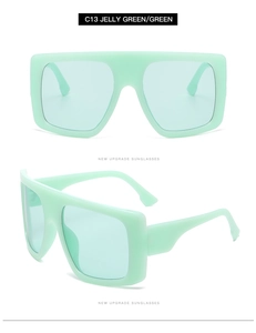 Detailed view of oversized jelly green wrap around sunglasses with integrated frame design