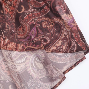 Bohemian paisley chiffon maxi dress featuring an irregular hemline and vintage red pattern