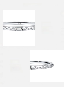 Detail of s925 silver ring featuring dotted texture and hand-set step-cut cubic zirconia