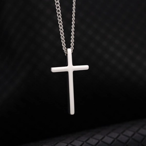 Polished silver stainless steel cross pendant with detailed twisted rope chain texture