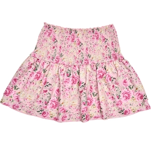 Detail of pink floral mini skirt featuring high elastic waist and layered ruffle hemline
