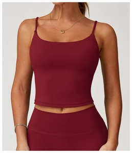 Close-up of double-stitch hem on wine red yoga crop top with high-stretch matte fabric