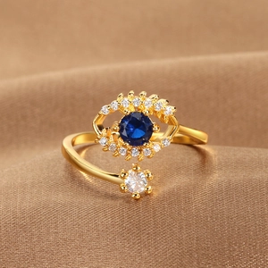Gold plated evil eye open ring with olive branch design and blue zircon stones