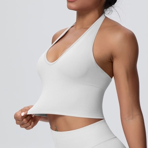 Detail view of breathable halter V-neck yoga bra and high waist ribbed fitness leggings