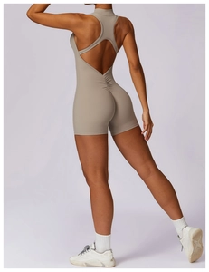 Detail view of khaki yoga jumpsuit showing back cutout and V-shaped seam for lifting effect