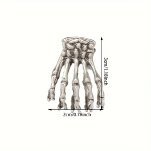 Silver metal mini skeleton hand hair claw with dimensions 3cm height and 2cm width