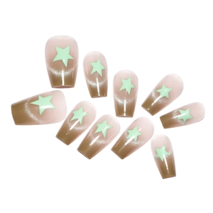 Short green gradient cat-eye press-on nails with star patterns in a coffin shape
