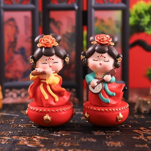 Macro shot of resin dolls playing flute and pipa with a traditional Chinese screen backdrop