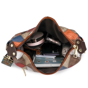 Quilted patchwork tote bag with large capacity interior showing tablet and essentials