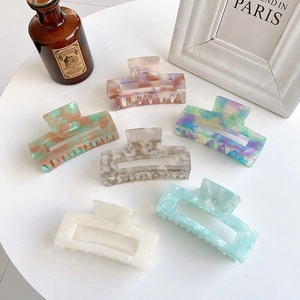 Set of 6 large acetate hair claws in assorted marble colors for thick hair