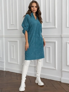 Detail of teal corduroy midi dress featuring V-neckline and buttoned cuffs on sleeves